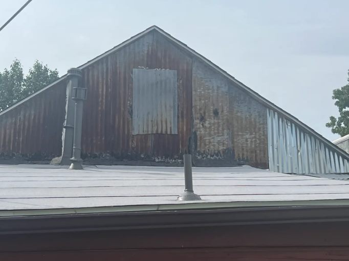 Before: weathered roof and wall, Jenks OK