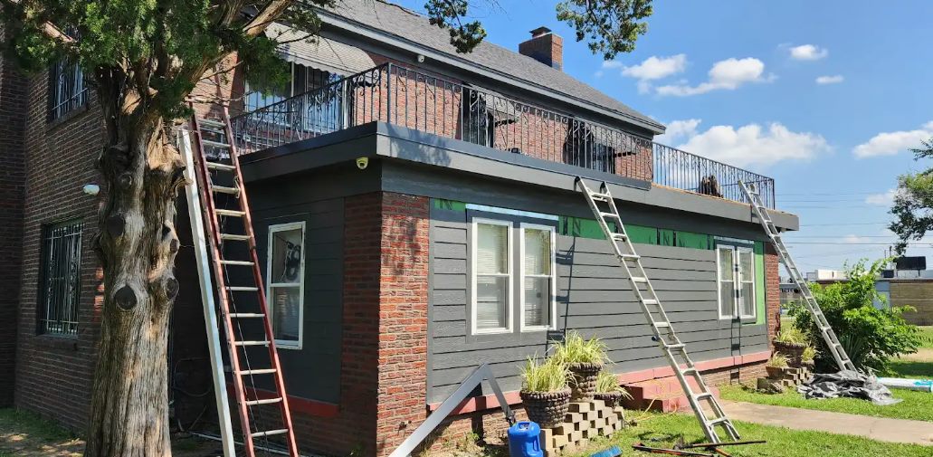 Residential flat roof re-roof on a brick building